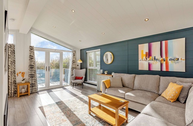 Luxurious lodge with vaulted ceilings and a welcoming feature fireplace.