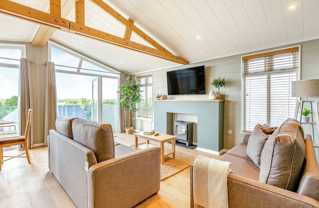 Luxurious lodge with vaulted ceilings and a welcoming feature fireplace.