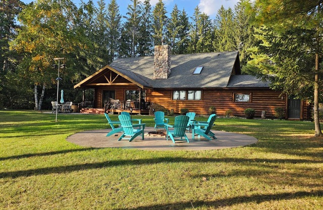 Luxurious Northwoods Log Lake house with over 500ft of lake frontage on 15 acres