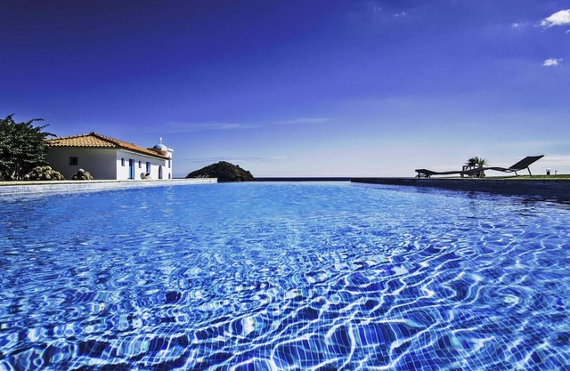 Luxurious seaside guest house with a shared pool and a breathtaking view