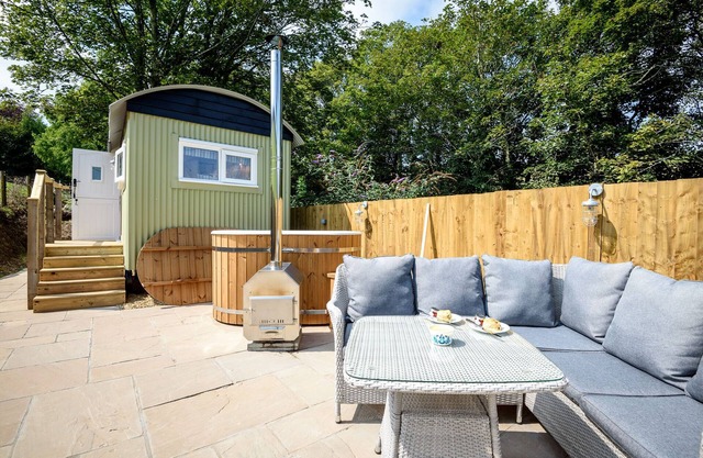 Luxury Coastal Shepherds Hut + hot tub, dining dome and outdoor kitchen.