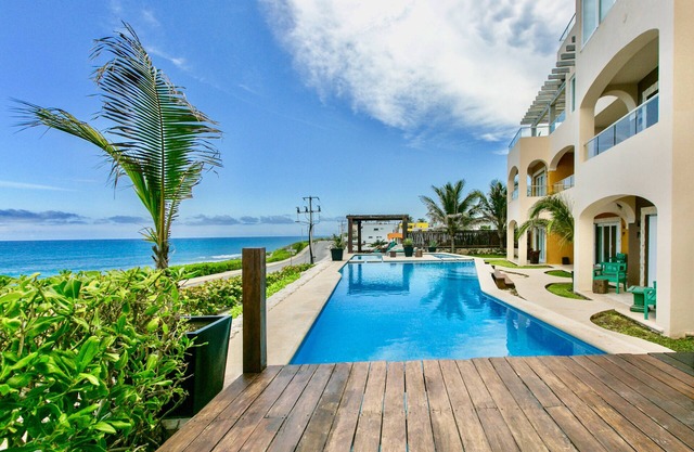 Luxury condo rooftop pool with 360° ocean views