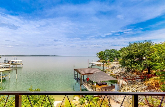 Luxury lake home with stunning water views, gourmet kitchen, hot tub & office