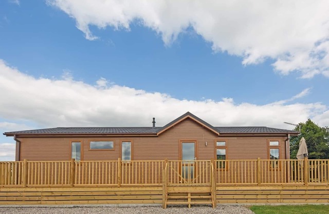 Luxury lodge with one double with freestanding bath.