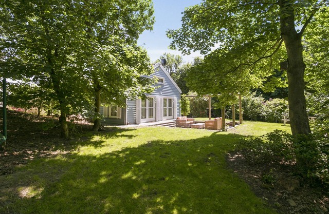 Luxury vacation home with sweeping views adjacent to nature reserve, beach and dunes within walking distance.