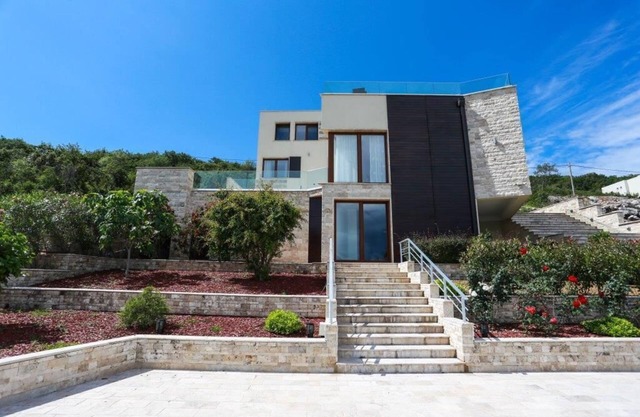 Luxury villa on the first line with a private beach and 2 pools