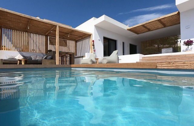 Luxury villa with large terrace, lounge area, pool, jacuzzi + magnificent sea view.