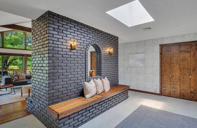 Mid-century home on seven serene acres of rolling meadows with private pool.