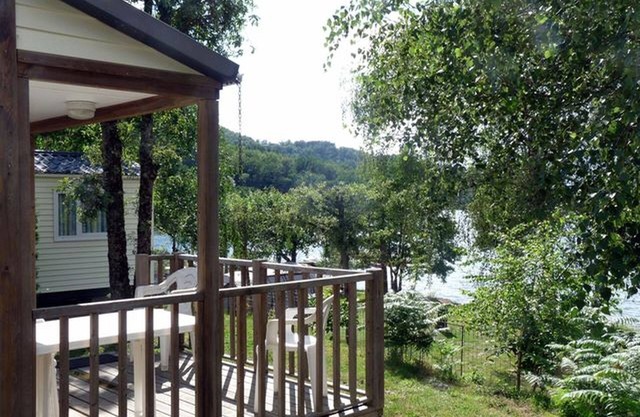 Mobile home beside a lake for fishing, calm, nature