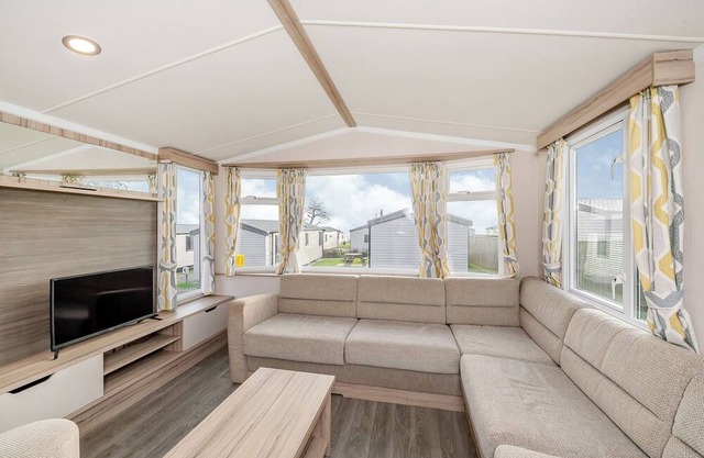 Modern and spacious 12ft-wide caravan with one double and two twin.