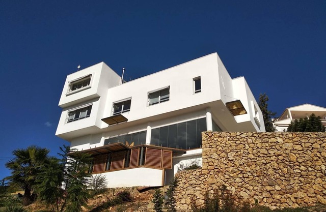 Modern house with indoor pool in urbanization with security service.