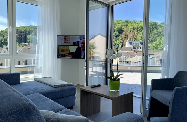 Modern penthouse apartment with terrace over the roofs of Remagen