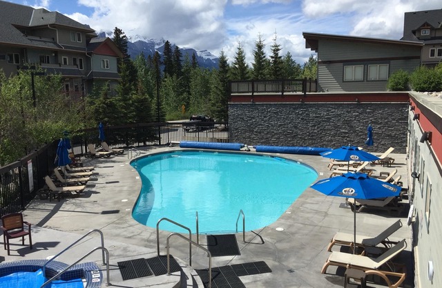 Modern, rustic mountain view loft style condo with pool, hot tubs & XL beds.