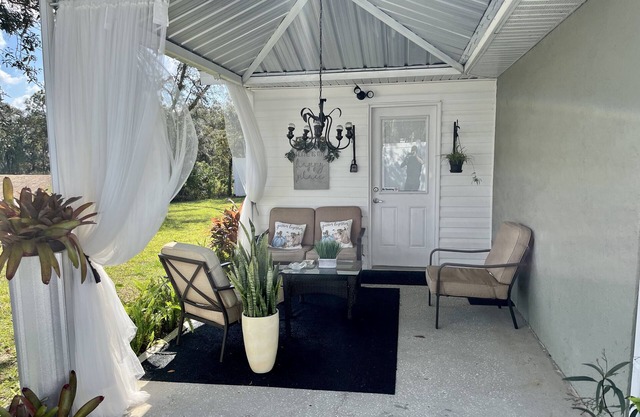 Modern studio apartment with covered outside seating area