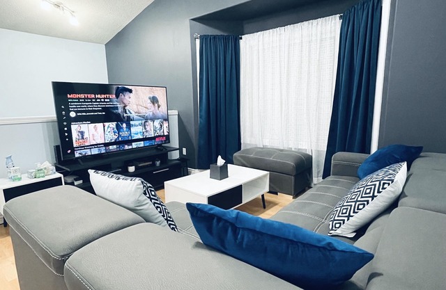 Modern Upper Level Duplex House Beside Convenience Store and Gasoline Station