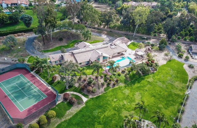 New list! Family ranch w/luxurious pool, spa & landscaping plus horse lodging!