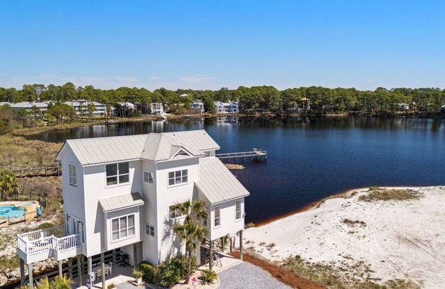 New Listing! Gulf and Lake Views! Private Dock! Beach Access Just Across the Street! Bikes!