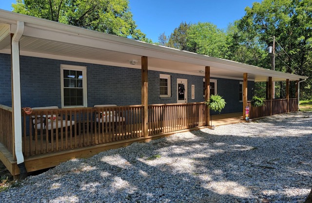 Newly renovated, charming brick home set on 45 acres with pond and hiking trails