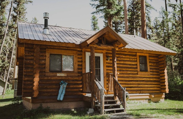 Nordic Cabin at Tamaracks Resort, a cozy log cabin with views of Seeley Lake.
