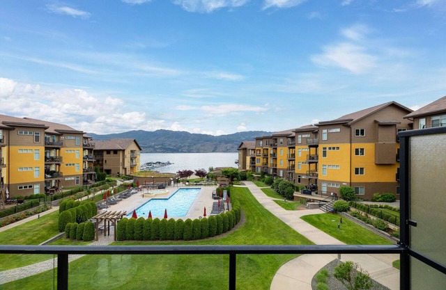 Okanagan Lake Beachfront Penthouse. 2 Bedrooms + den, 3 bath. Boatslip Option.