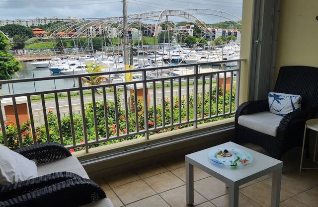 One level large villa apartment offering waterfront, and marina views.