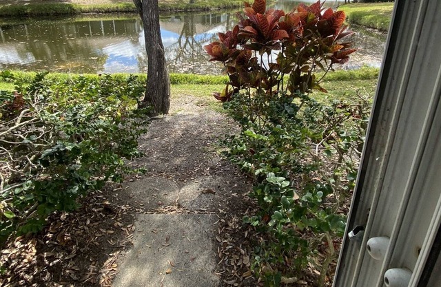 One story Villa in golf community with lake view & walking path