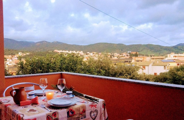 panoramic house surrounded by greenery with parking
