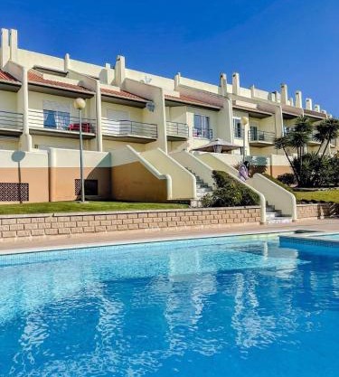 Peniche master bedroom with sea view balcony, private bathroom, shared kitchen, swimming pool, surfing resort