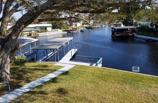 PETS STAY FREE Canal Front 3 bed/2 bath single family ample parking