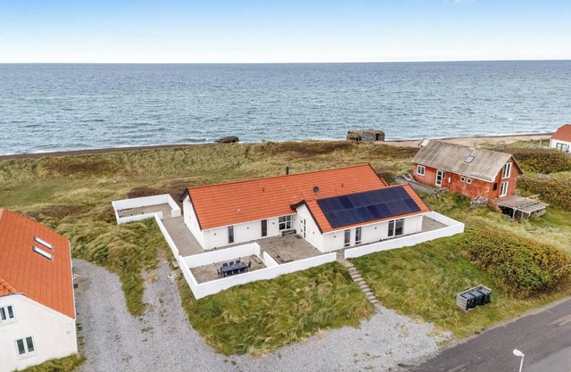 Pool and activity house with a 180-degree view of the North Sea, located at.