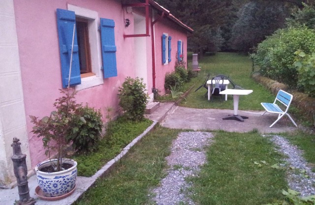Pretty pink house with blue shutters