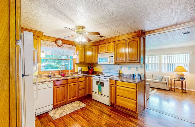 Private community home with on-site pool, screened patio, central AC, & W/D