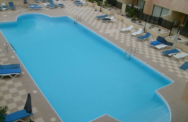 Queens Gardens holiday townhouse rental with shared pool, beach nearby,