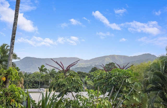 Refreshed Family Home with Large Deck and Tropical Mountain View