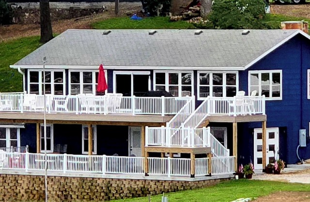 Relax by Lake of the Ozarks in your spacious Sunrise Beach retreat on 1 acre.