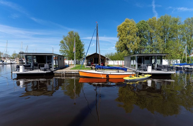 Rent a Luxury Houseboat in and on the water in the water sports village of Heeg!