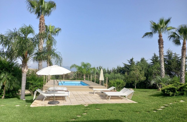 Sea apartment in villa with swimming pool.