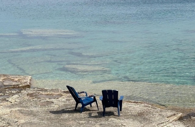 Seafari is a charming stone cottage on Georgian Bay with stunning bluff views, a flat rock shoreline, and a cozy bunkie. Perfect for relaxing, swimming, and exploring.
