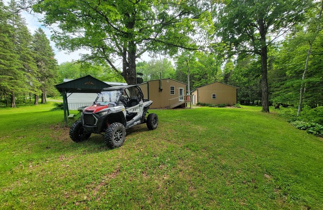 Secluded camp off the snowmobile trail