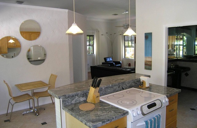 Secluded, tropical, riverfront environment with South Florida flora and fauna.