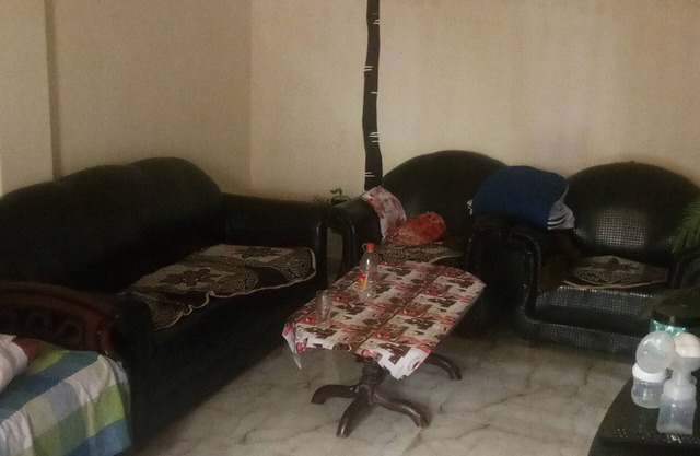 semi furnished Flat For Rent with one queen size bed and 4 chairs dining table