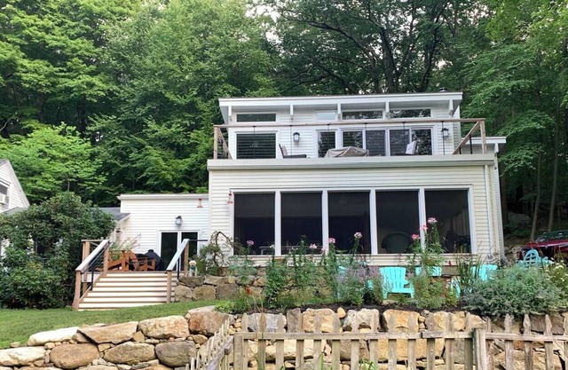 Serene wooded 15 acre property with pool and two separate guest houses in summer