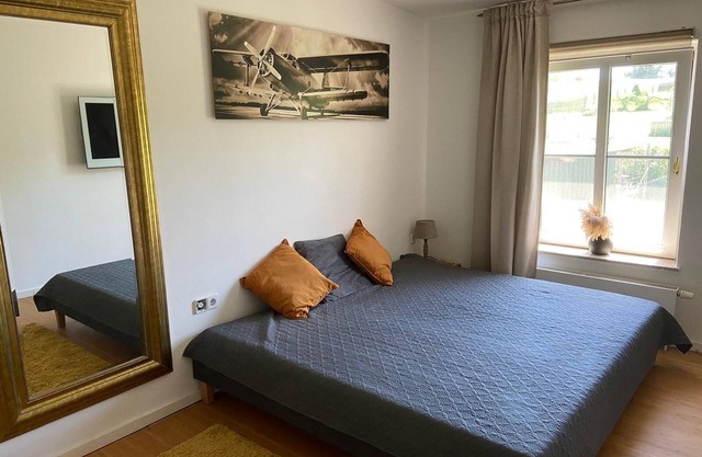 Shared living room, open kitchen, wellness, 2 double bedrooms with bathrooms.