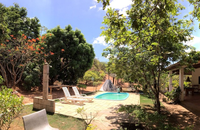 Site with typical country house, woods, swimming pool, barbecue and wood stove