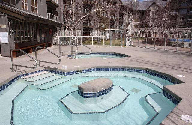 Slope-side condo ski in ski out! Quiet side of resort, heated pool + 3 hot tubs