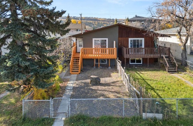 Spacious 4-Bedroom Retreat Near Bow River with Foosball, Dart Board, Movie Room