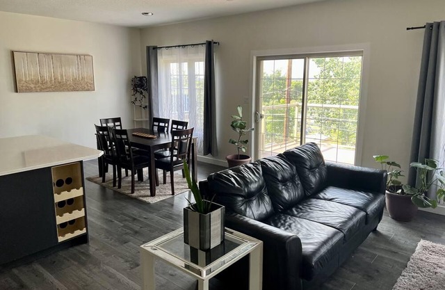 spacious 5 bedroom home with a game room, walk-in basement, and overlooking deck