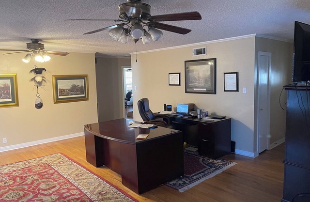 Spacious 5 bedrooms with an office, 2 kitchens, and 2 large porches in Flint.