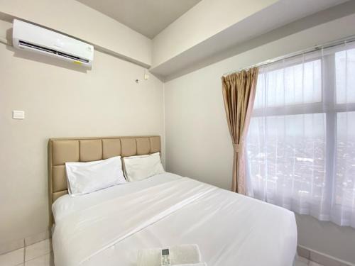 Spacious and Homey 2BR Apartment at Newton Residence By Travelio