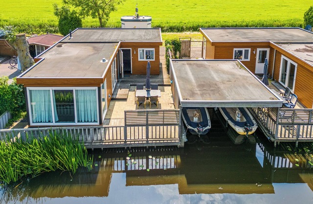 Spacious waterfront chalet including a sloop